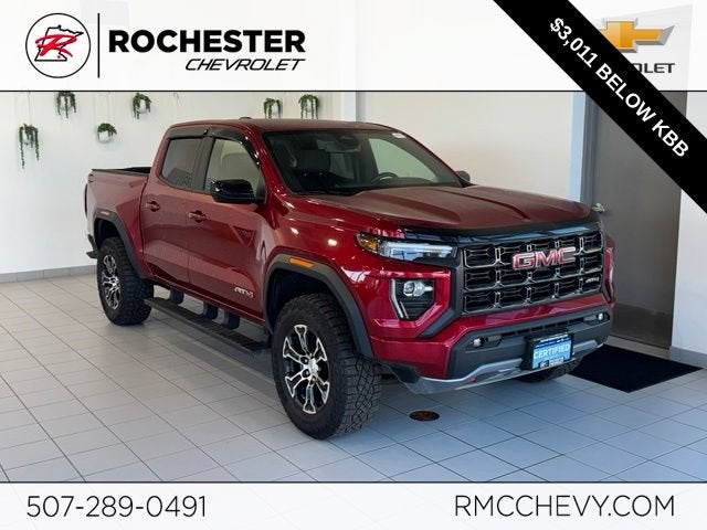 2024 GMC Canyon AT4 in Volcanic Red Tintcoat — front three-quarter view