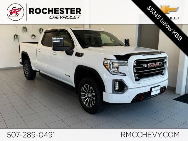 2023 GMC Sierra 1500 AT4 in Summit White — front three-quarter view