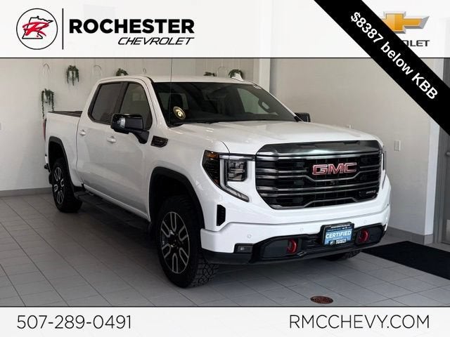 2023 GMC Sierra 1500 AT4 in Summit White — front three-quarter view