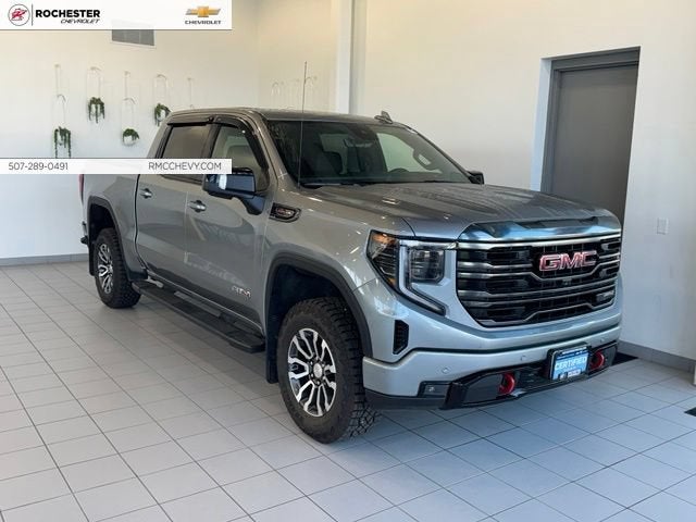 2023 GMC Sierra 1500 AT4 in Sterling Metallic — front three-quarter view
