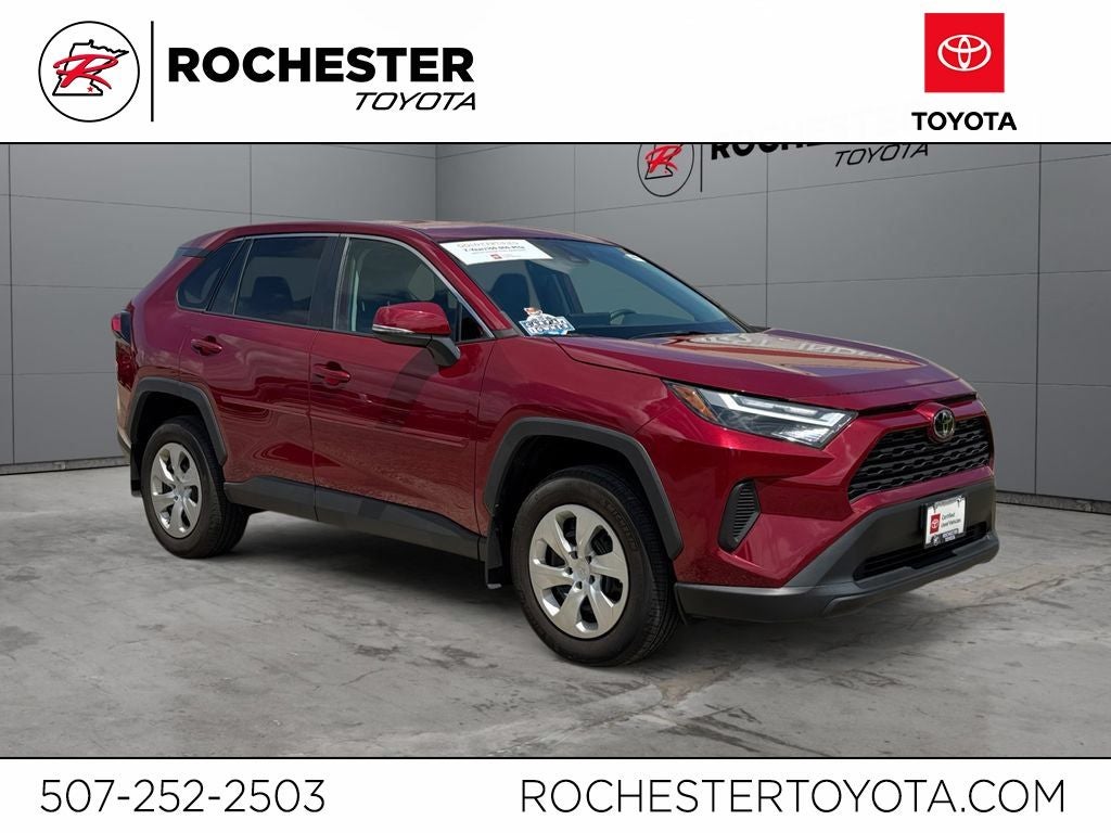 2023 Toyota RAV4 LE AWD in Ruby Flare Pearl — front three-quarter view