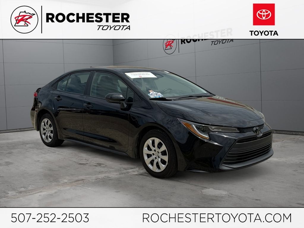 2023 Toyota Corolla LE FWD in Midnight Black Metallic — front three-quarter view