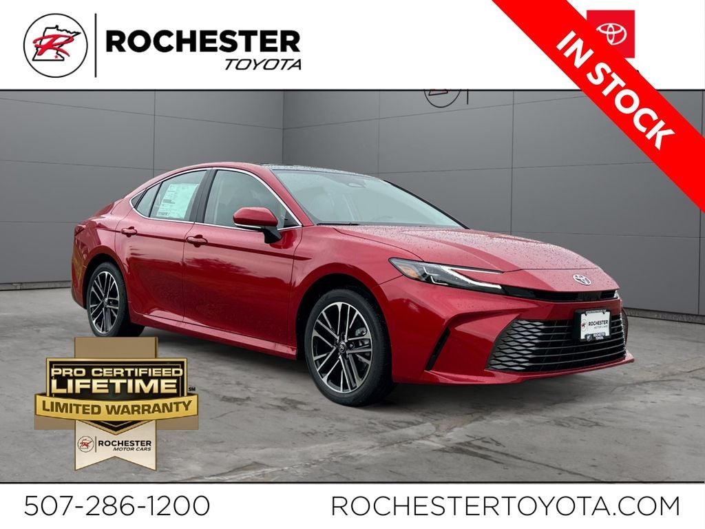 2026 Toyota Camry XLE in Supersonic Red — front three-quarter view